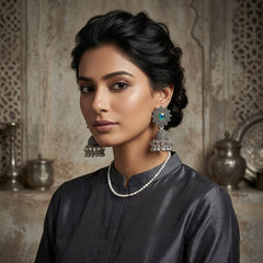EL ARO Oxidised Silver Sunflower Jhumka Earrings with Green Peacock Eye Stone